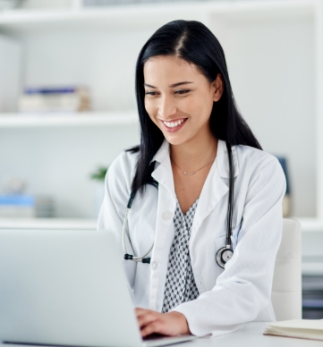 Doctor on laptop looking at the services ScaffoldMED offers