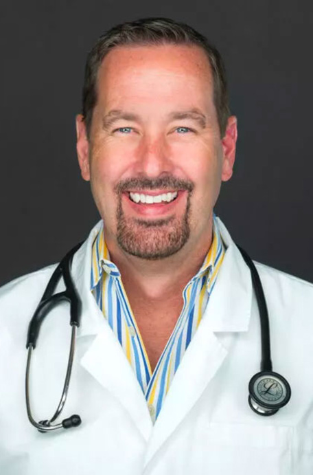 Dr Rush Head shot in lab coat